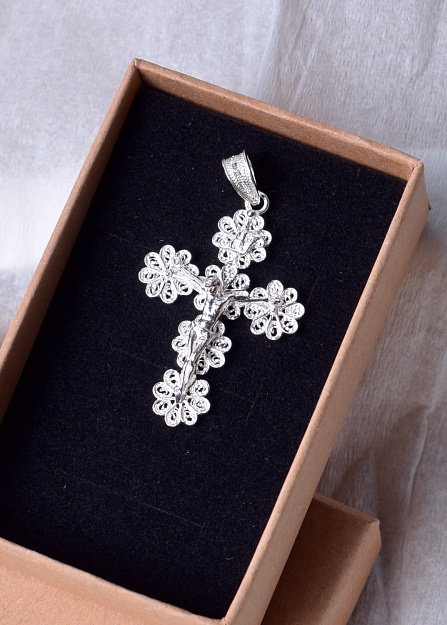 Silver cross with a figure of Jesus